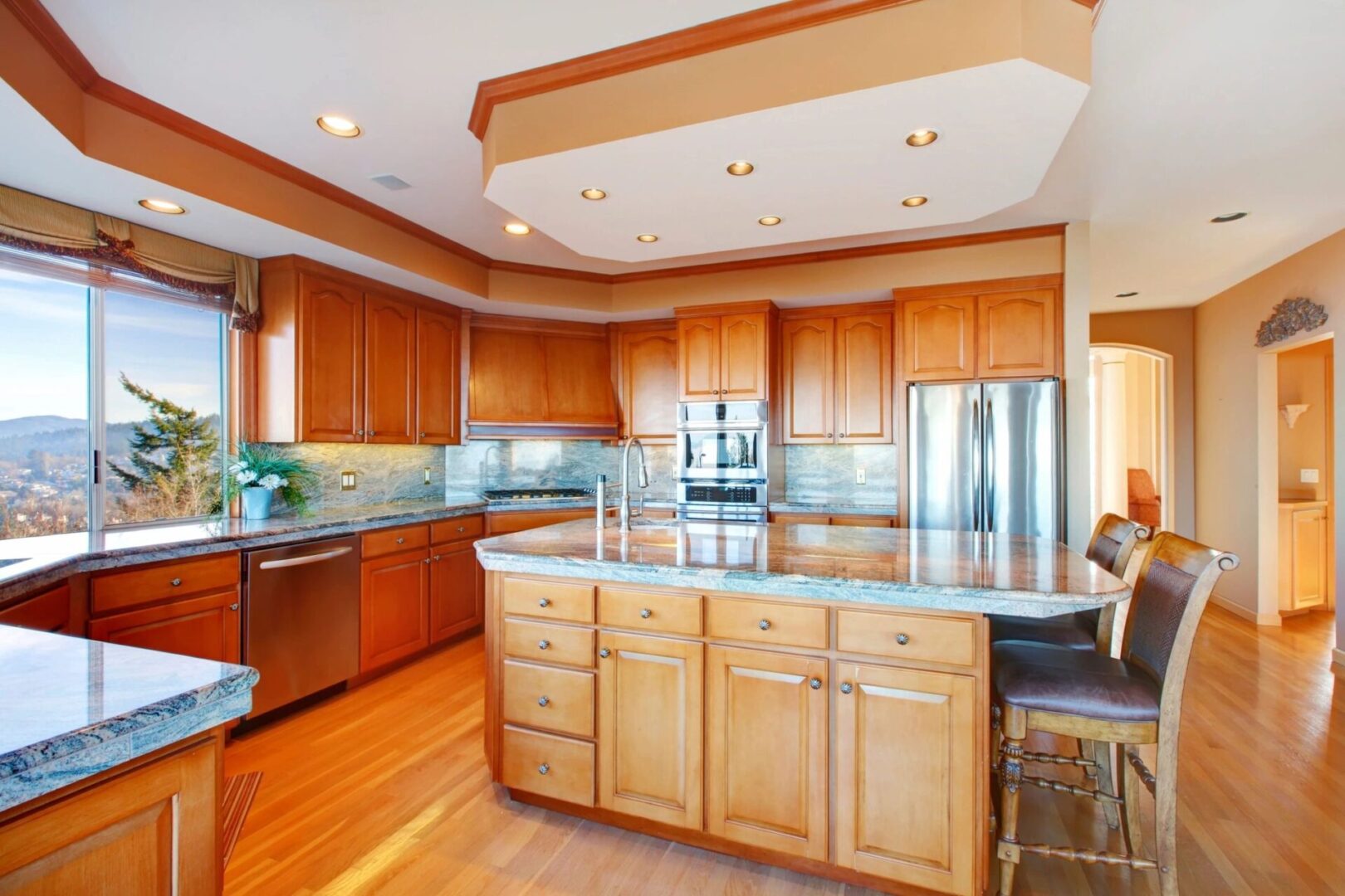 A kitchen with wooden cabinets and stainless steel appliances.