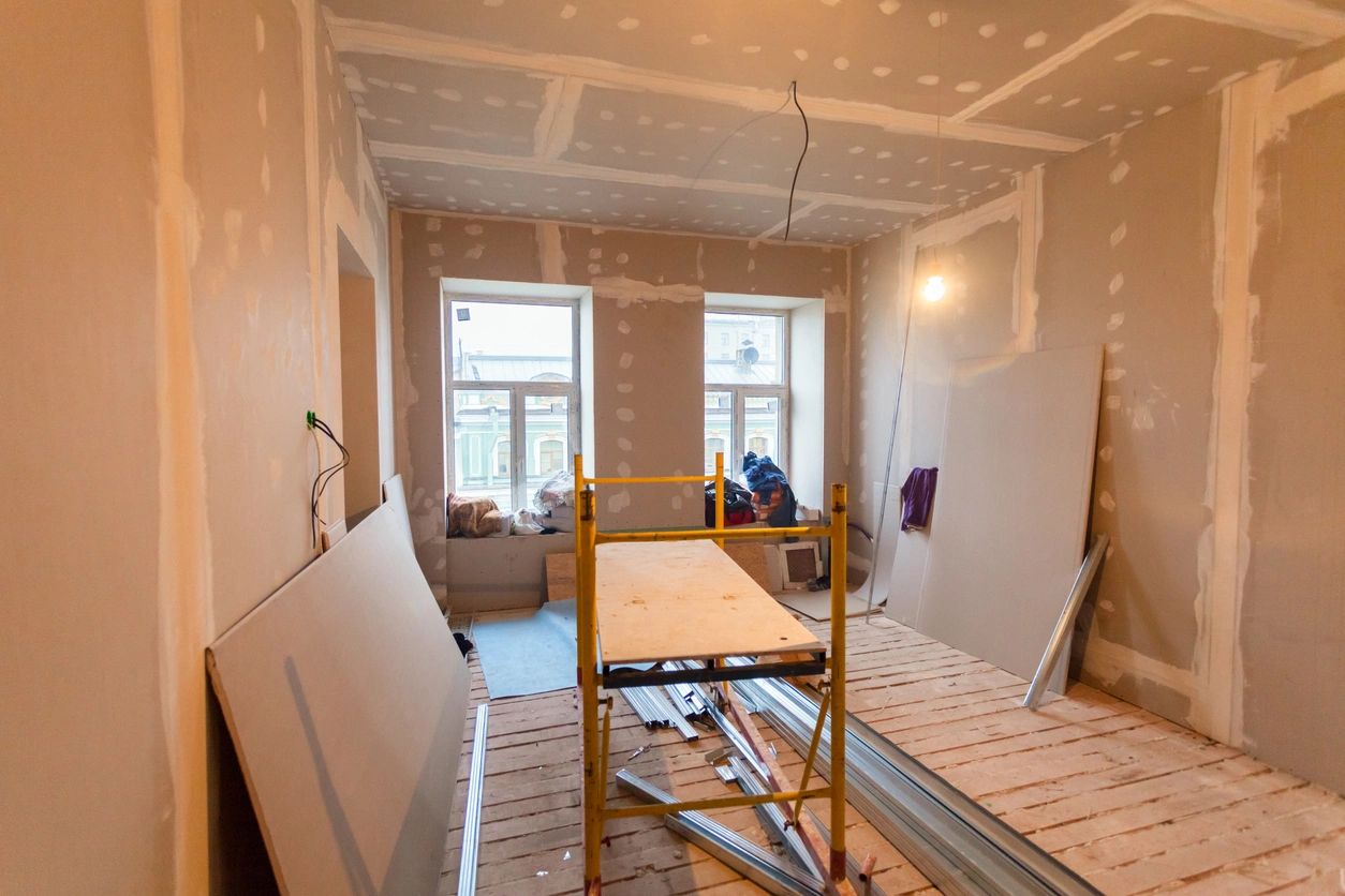 A room being remodeled with the walls and ceiling removed.